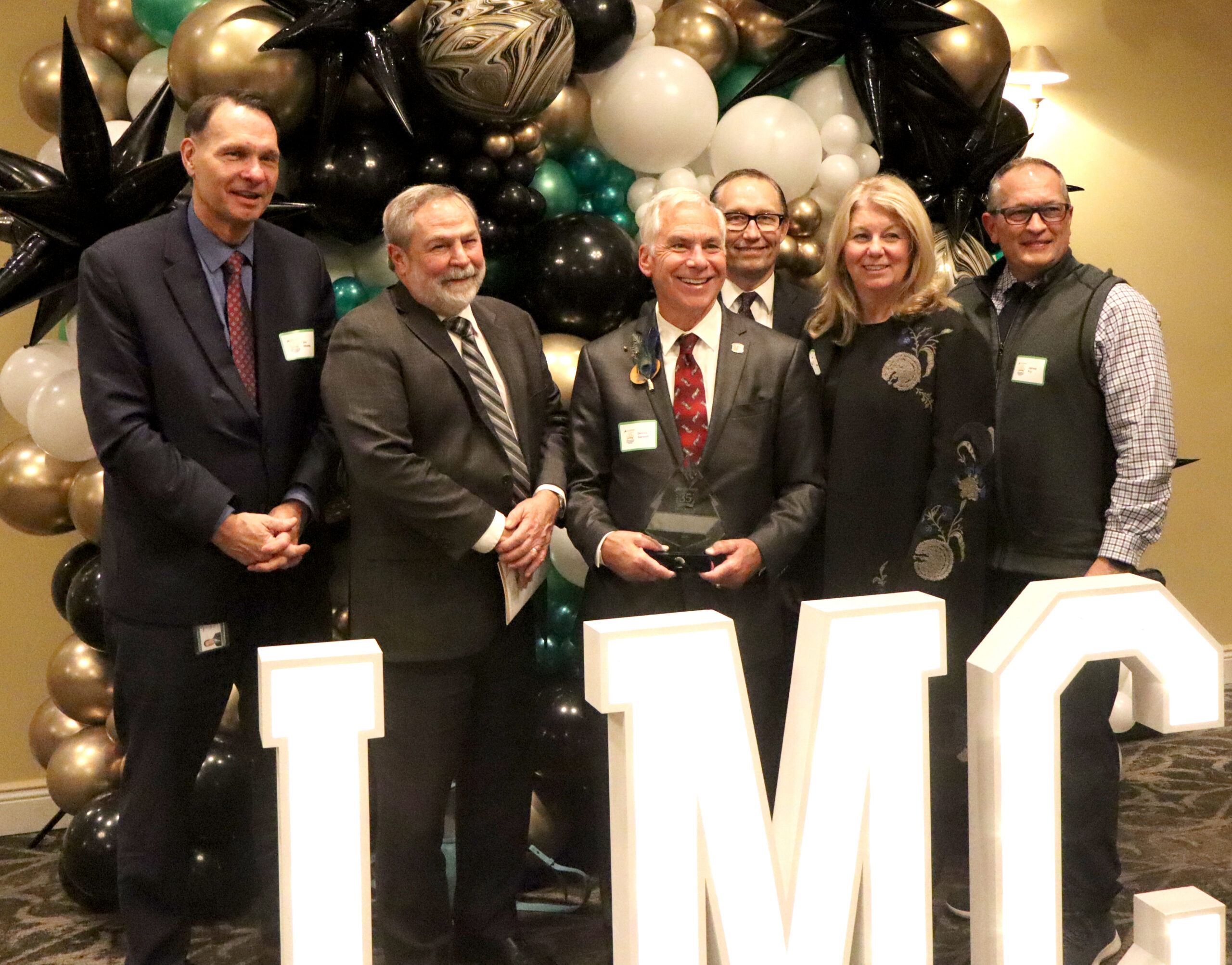 Dennis Hanwell with Mayor Jim Shields and City Staff.
