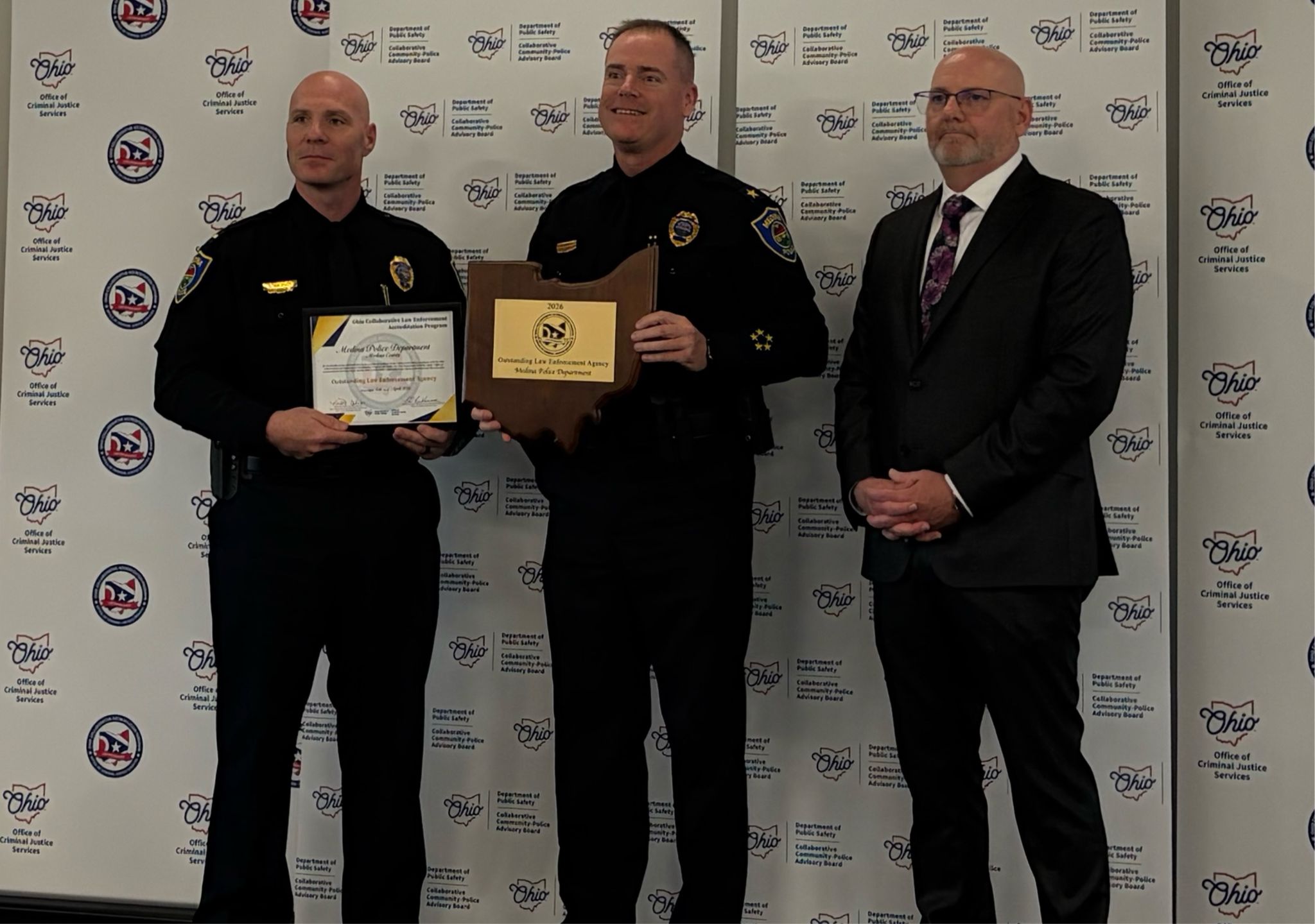 Chief Kinney and Lt. Wagner holding awards