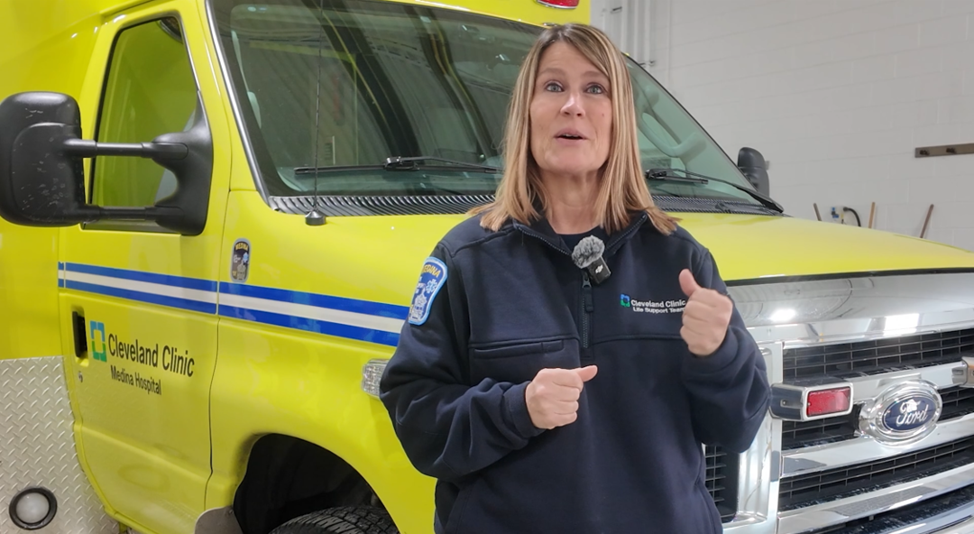 Jenny Goe in front of LST Ambulance