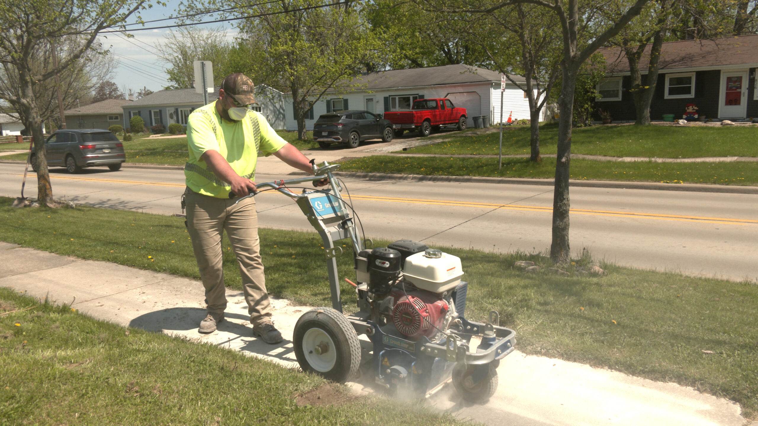 City Crew grinding sidewalk